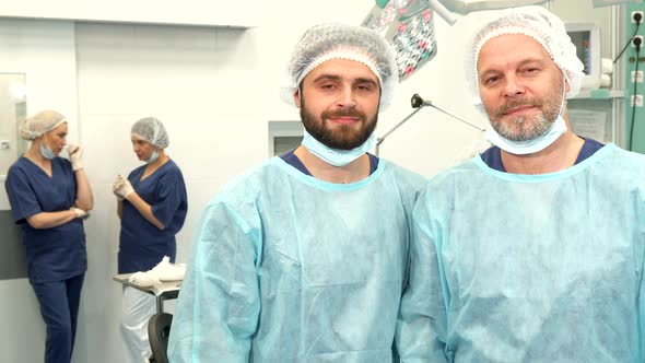 Two Surgeons Pose at the Surgery Room