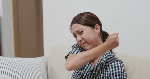 Woman suffer from shoulder pain at home