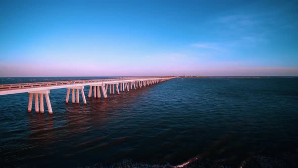 A view of a bridge, journey in a clean and clear sea