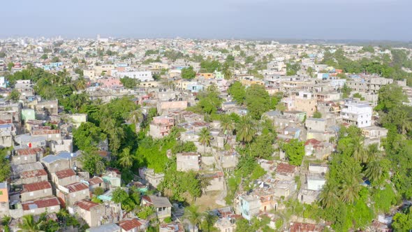 Dramatic shot of poor area in Santo Domingo city. Aerial orbit