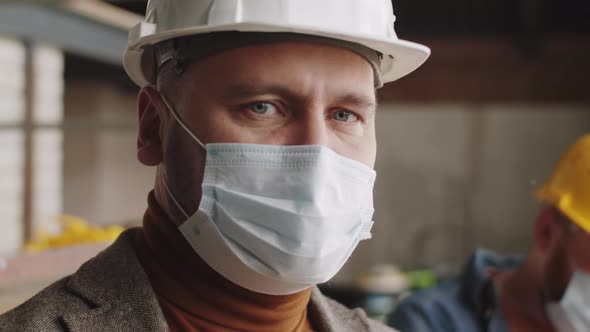 Portrait of Architect in Protective Face Mask at Work