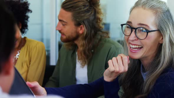 Happy colleagues interacting with each other 4k