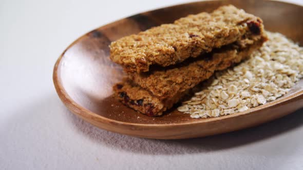 Granola bar and oatmeal in bowl 4k