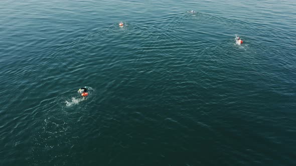 Swimmers Exercising in Open Sea Waters