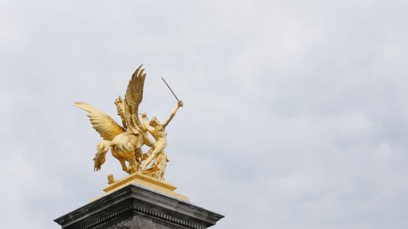 Beautiful art of Alexander III bridge golden statues in Paris France slow tilt 4K 2160p UltraHD tilt