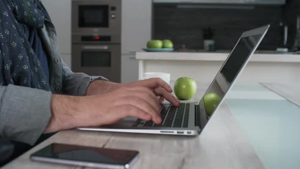 Man in Wheelchair Using Laptop Computer