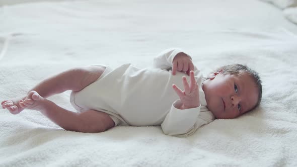 Close-up portrait of a young baby who has recently been born.