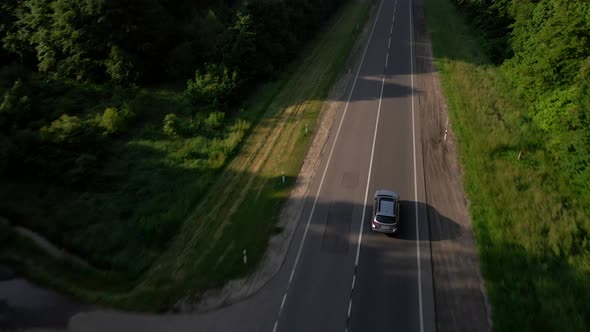 Aerial View of Car Moving By Road Tracking