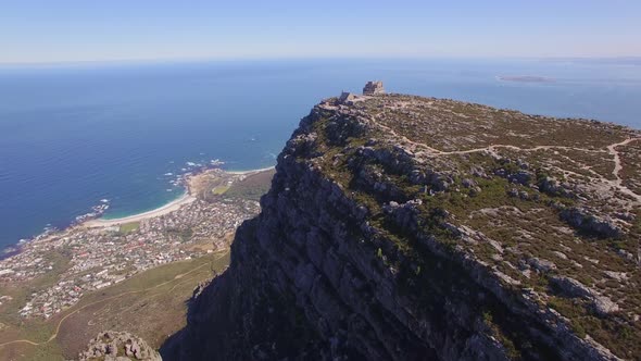 Aerial travel drone view of Cape Town from the top of Table Mountain, South Africa.