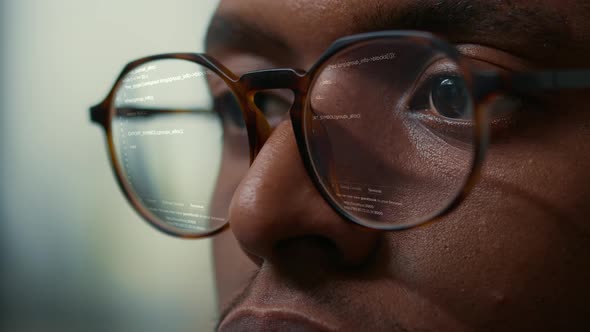 Vfx of Running Programming Code Reflected in Software Developer Glasses