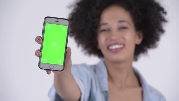 Face of Young Happy African Woman Showing Phone