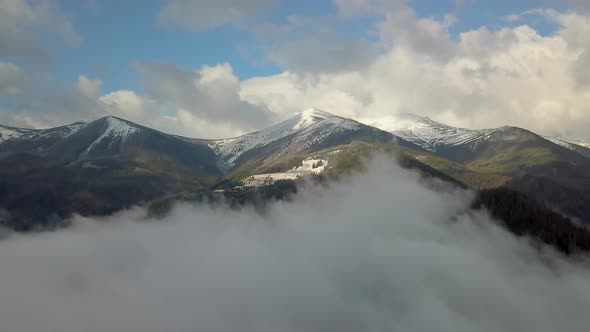 Flying Above the Clouds in the Mountains