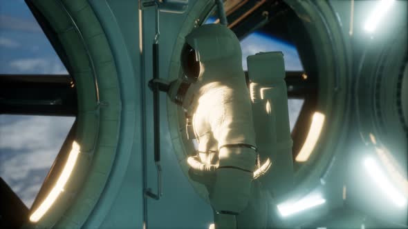 Astronaut Inside the Orbital Space Station