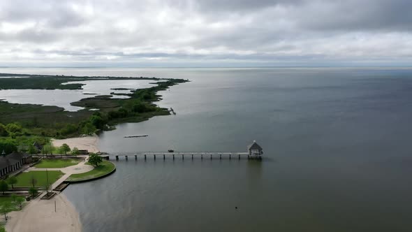 Nature Landscape With Fontainebleau Beach Pier In Mandeville, Louisiana, USA - aerial pullback