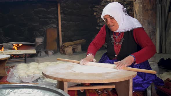 Peasant Woman Preparing Turkish Traditional Bread In Village House