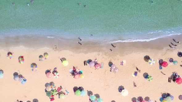 Aerial Top View of Crowded Sand Beach and Calm Azure Sea Water