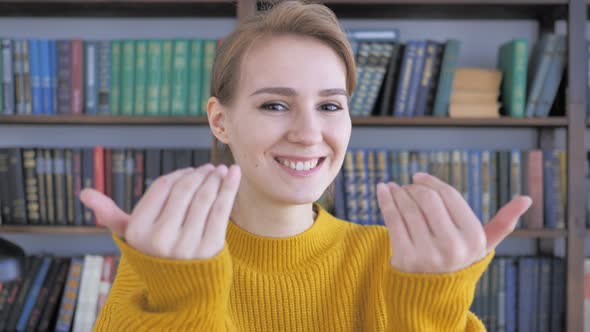 Inviting Gesture by Young Woman