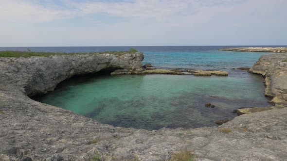 The Caribbean Sea surrounded by cliffs in Jamaica