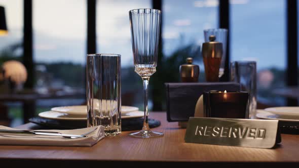 Cutlery on Reserved Table in Luxury Restaurant Without People