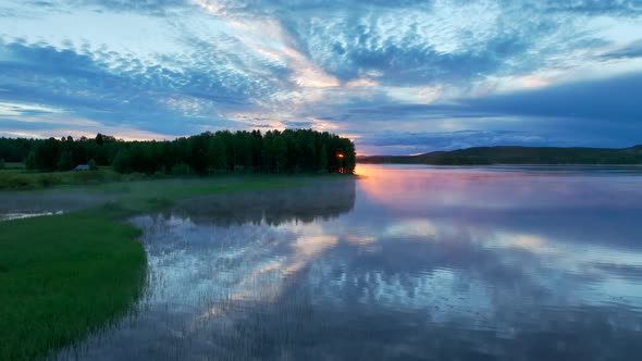 Aerial view of a lake at sunset in Overtornea, Sweden.