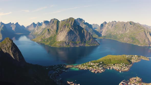 Flying Above Reine Fishing Village with Mountains and Fjords on Lofoten Islands