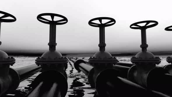 Petroleum Pipes with valves over a large sea of black oil