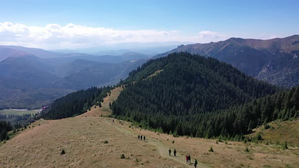 Young People On Spectacular Mountain Trail