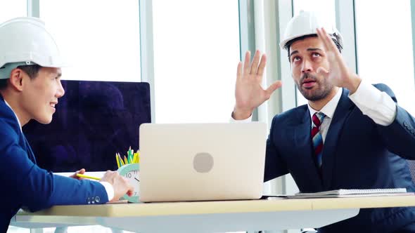 Engineer and Architect Meeting at Office Table