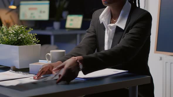 Focused Black African American Businesswoman Working Overtime at Company Management Presentation