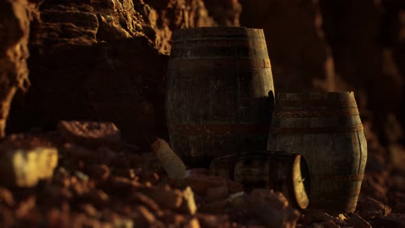 Old Wooden Vintage Wine Barrels Near Stone Wall in Canyon