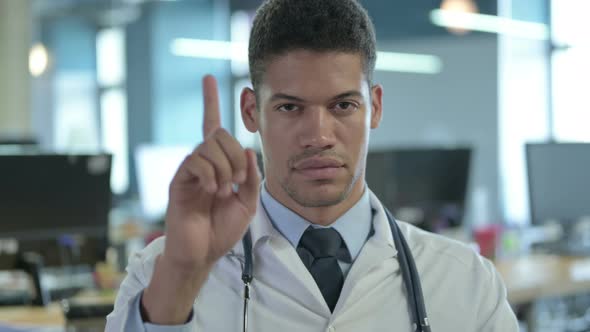 Portrait of African Doctor Saying No with Finger Gesture