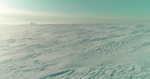 Aerial View of Cold Winter Landscape Arctic Field Trees Covered with Frost Snow Ice River and Sun