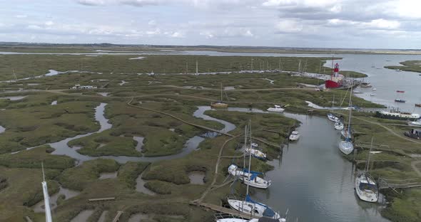 Low, left to right pan above yachts in Tollesbury Marina