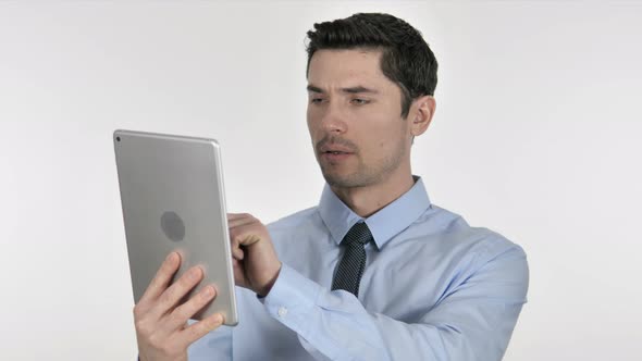 Businessman Browsing Internet on Tablet