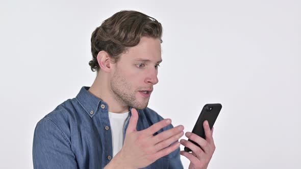 Young Man with Loss on Smartphone, Failure on White Background