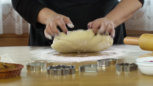 Women's Hands Sprinkles Dough with Flour and Kneads Dough Hands Baking Pastry