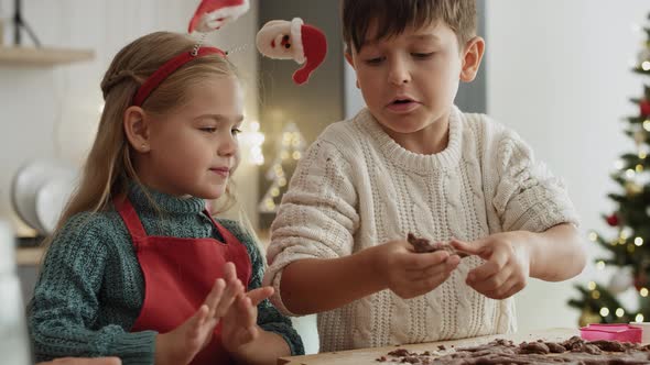 Video of children  helping mother with baking cookies. Shot with RED helium camera in 8K.