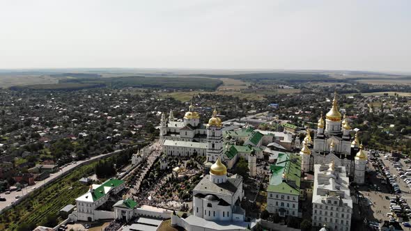 Top view of the Pochaev Lavra at the moment when a lot of people enter it.