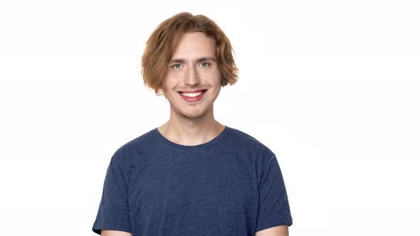 Portrait of Happy Hairy Man in Casual Tshirt Looking on Camera and Smiling with Perfect Teeth