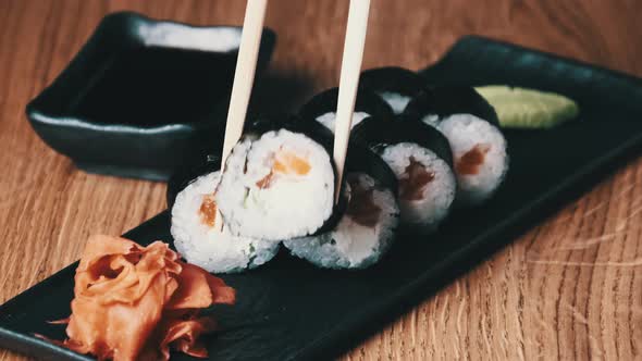 Sushi on a Wooden Table in Restaurant Delicious Japanese Food Sushi Rolls