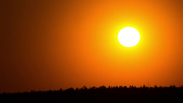 Time Lapse Bright Orange Sunset Sun Sets Behind the Clouds