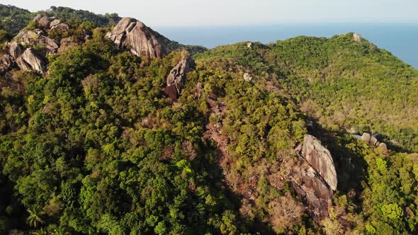 Jungles and Mountains of Tropical Island. Drone View of Green Jungles and Huge Boulders on Volcanic