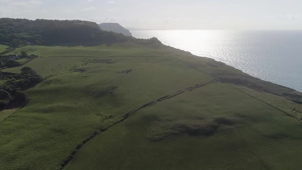 Fields on the edge of the Jurassic coast, Charmouth Dorset. Amazing scale revealing aerial of the co