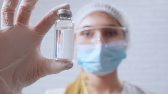 Nurse Holding Vaccine From Covid2019 in Hand