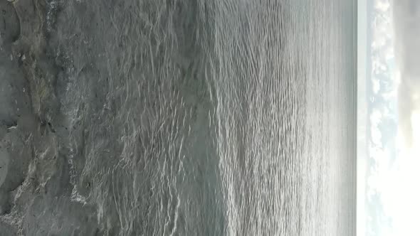 Vertical Video of the Ocean Near the Coast of Zanzibar Tanzania Aerial View