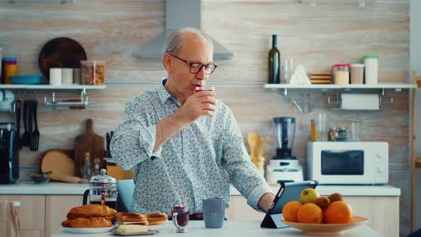 Senior Man Using Tablet Computer