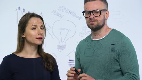 Man and Woman Shake Hands and Discuss the Business Strategy for Success in a Modern Glass Office