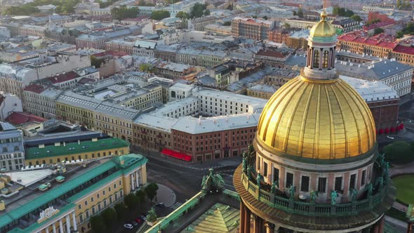 Aerial Morning Cityscape with Golden Dome of Isaac Cathedral at Sunrise Columns and Cross of Church