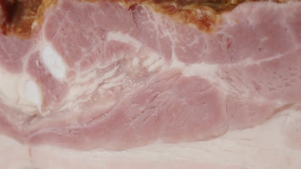 Panning on layers of smoked pork meat product  close-up 4K 2160p 30fps UltraHD  footage - Texture of