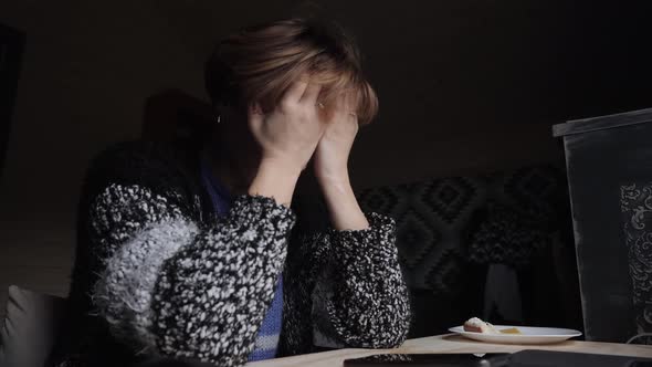 Portrait of a Tired Girl Sitting in Front of a Computer.